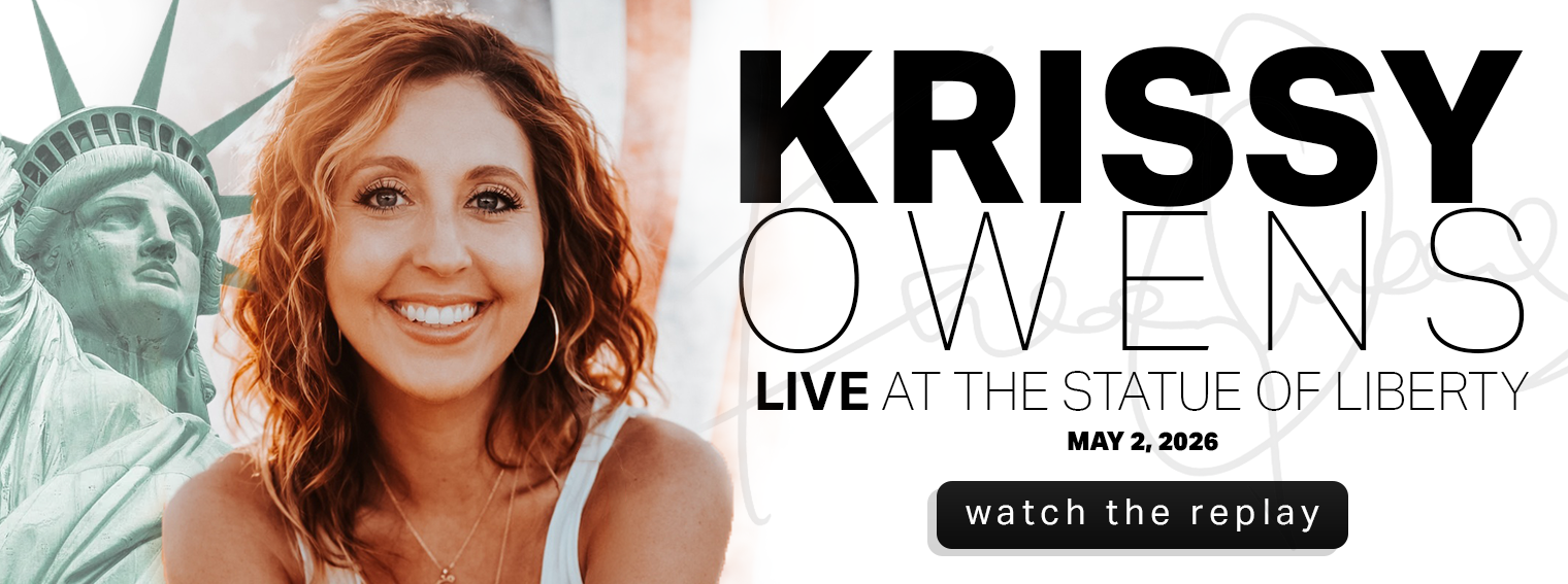 Krissy Owens Website Hero Image - Krissy Owens at the Statue of Liberty May 2 2026 - UPDATED